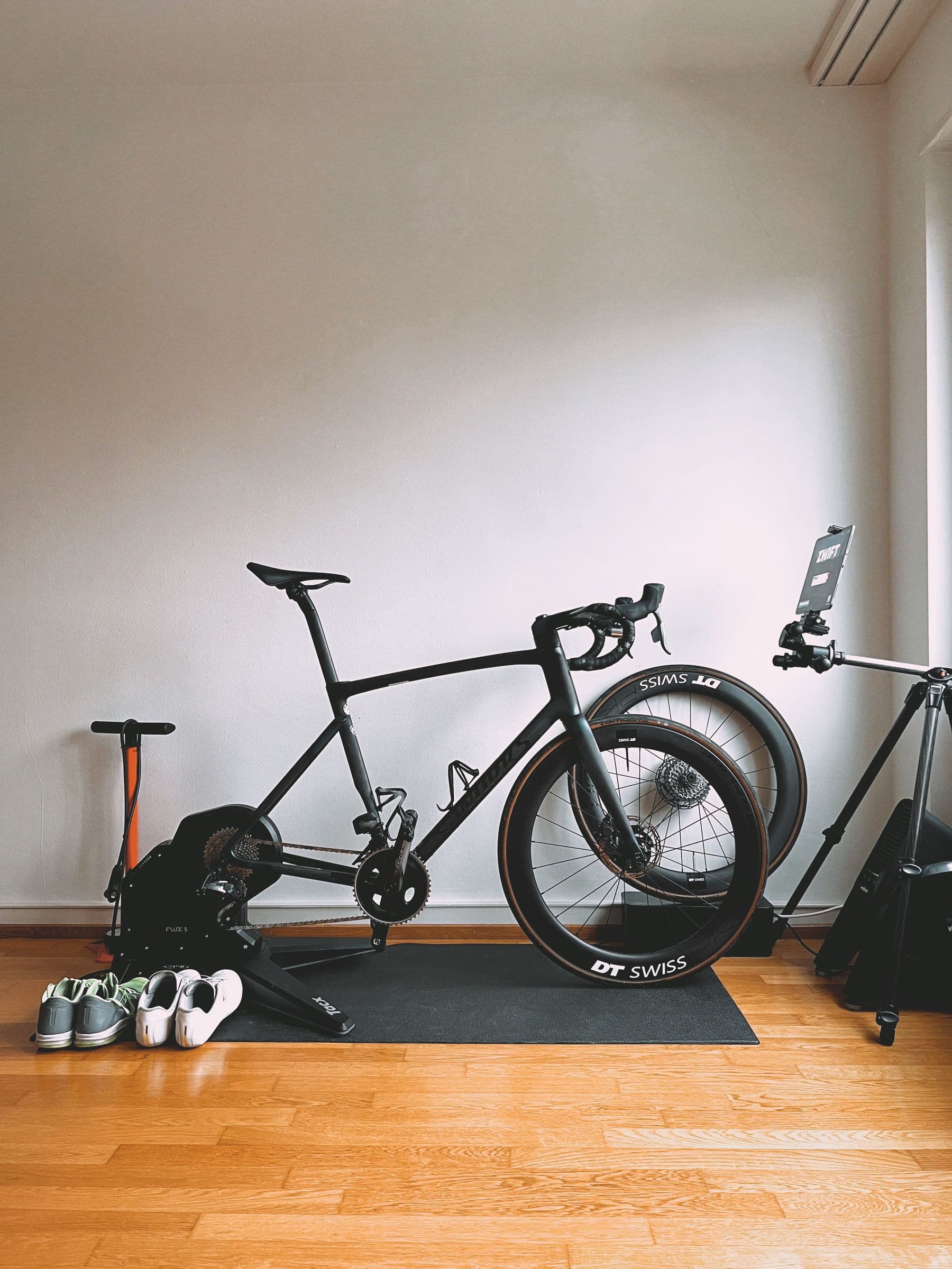 A road bicycle mounted on a smart trainer at home